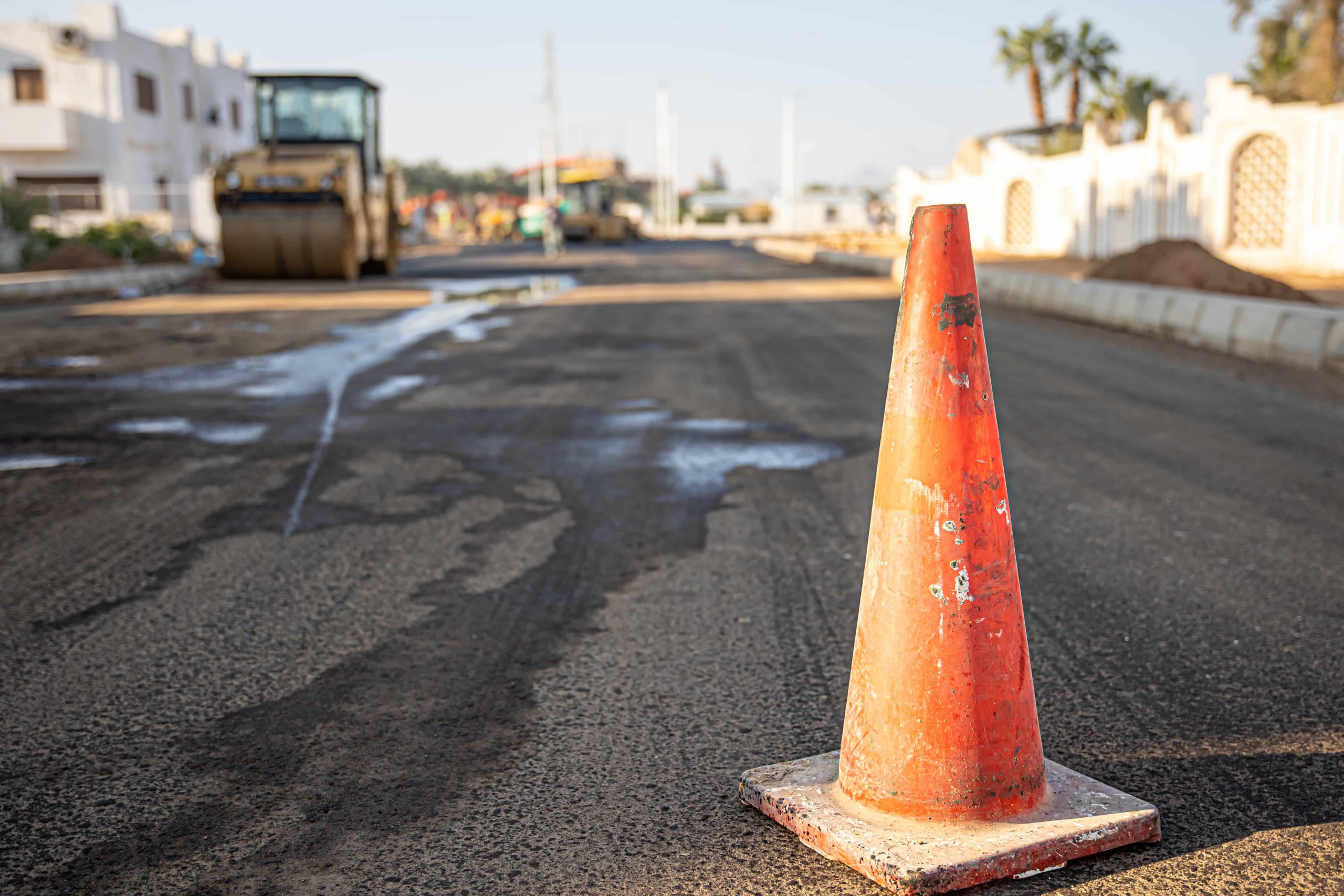 close-up-orange-traffic-cone-road-copy-space